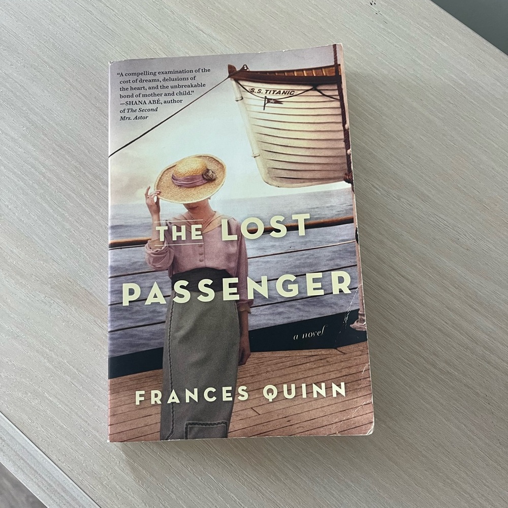 The Lost Passenger by — Paperback Novel (Green, Pink Accents)